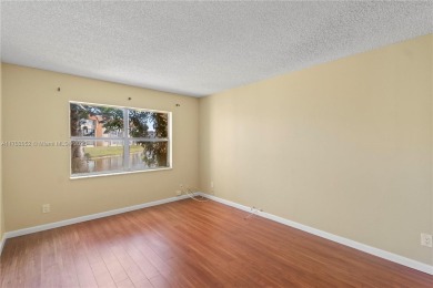 Imagine stepping out your front door and being just steps away on Sunrise Lakes Phase III in Florida - for sale on GolfHomes.com, golf home, golf lot