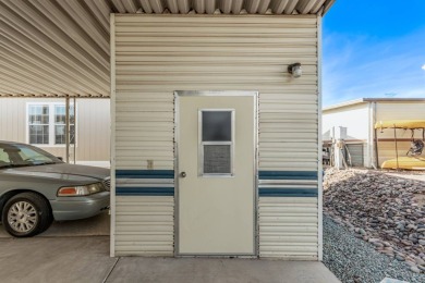 1 BEDROOM 1 BATH PARK MODEL WITH STORAGE SHED AND 2 CAR COVERED on Riverview Golf Course in Arizona - for sale on GolfHomes.com, golf home, golf lot