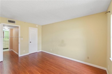 Imagine stepping out your front door and being just steps away on Sunrise Lakes Phase III in Florida - for sale on GolfHomes.com, golf home, golf lot
