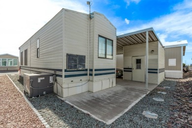 1 BEDROOM 1 BATH PARK MODEL WITH STORAGE SHED AND 2 CAR COVERED on Riverview Golf Course in Arizona - for sale on GolfHomes.com, golf home, golf lot