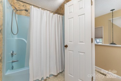 You must see this light-filled, two-story end unit condo at The on Black Mountain Golf Course in North Carolina - for sale on GolfHomes.com, golf home, golf lot