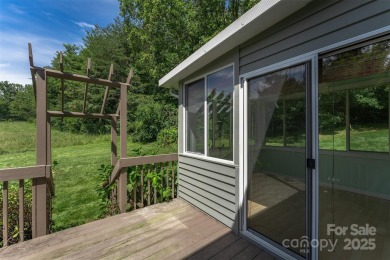 You must see this light-filled, two-story end unit condo at The on Black Mountain Golf Course in North Carolina - for sale on GolfHomes.com, golf home, golf lot