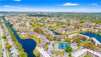 Imagine stepping out your front door and being just steps away on Sunrise Lakes Phase III in Florida - for sale on GolfHomes.com, golf home, golf lot