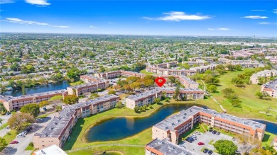 Imagine stepping out your front door and being just steps away on Sunrise Lakes Phase III in Florida - for sale on GolfHomes.com, golf home, golf lot