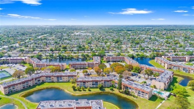 Imagine stepping out your front door and being just steps away on Sunrise Lakes Phase III in Florida - for sale on GolfHomes.com, golf home, golf lot