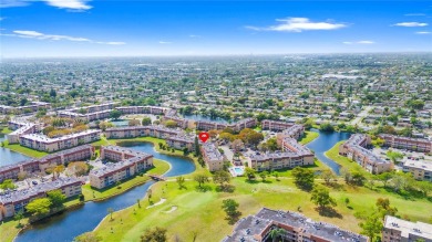Imagine stepping out your front door and being just steps away on Sunrise Lakes Phase III in Florida - for sale on GolfHomes.com, golf home, golf lot