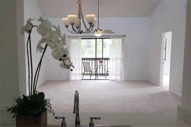 Newly painted, spacious corner unit 2/2 condo with water views on Village Golf Club in Florida - for sale on GolfHomes.com, golf home, golf lot