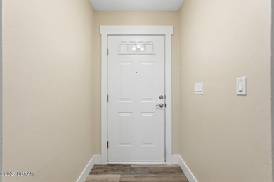 Beautifully updated home in a quiet New Smyrna Beach on Hidden Lakes Golf Club in Florida - for sale on GolfHomes.com, golf home, golf lot