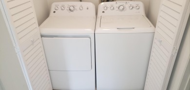 Newly painted, spacious corner unit 2/2 condo with water views on Village Golf Club in Florida - for sale on GolfHomes.com, golf home, golf lot