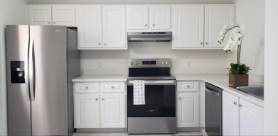 Newly painted, spacious corner unit 2/2 condo with water views on Village Golf Club in Florida - for sale on GolfHomes.com, golf home, golf lot