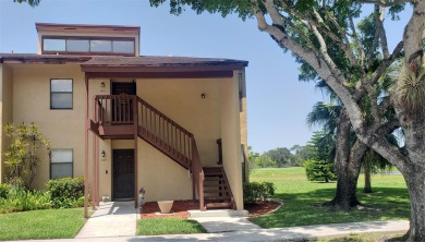 Newly painted, spacious corner unit 2/2 condo with water views on Village Golf Club in Florida - for sale on GolfHomes.com, golf home, golf lot