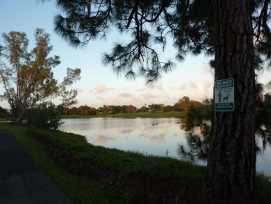 Newly painted, spacious corner unit 2/2 condo with water views on Village Golf Club in Florida - for sale on GolfHomes.com, golf home, golf lot