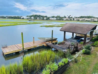 Welcome to 75 Marsh Hen Drive, a truly exceptional creekfront on Pawleys Plantation Golf and Country Club in South Carolina - for sale on GolfHomes.com, golf home, golf lot
