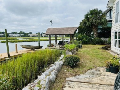 Welcome to 75 Marsh Hen Drive, a truly exceptional creekfront on Pawleys Plantation Golf and Country Club in South Carolina - for sale on GolfHomes.com, golf home, golf lot