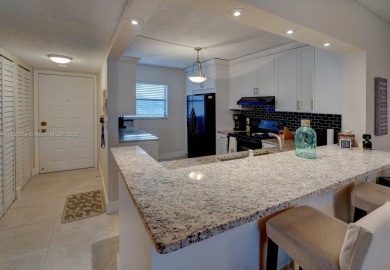 COME AND FALL IN LOVE WITH THIS TASTEFULLY RENOVATED CONDO! 2 on Inverrary Country Club in Florida - for sale on GolfHomes.com, golf home, golf lot