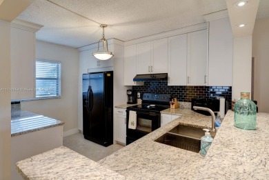 COME AND FALL IN LOVE WITH THIS TASTEFULLY RENOVATED CONDO! 2 on Inverrary Country Club in Florida - for sale on GolfHomes.com, golf home, golf lot