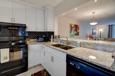 COME AND FALL IN LOVE WITH THIS TASTEFULLY RENOVATED CONDO! 2 on Inverrary Country Club in Florida - for sale on GolfHomes.com, golf home, golf lot