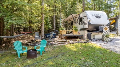 Discover a pristine 0.14-acre lot tucked away on a quiet private on River Golf and Country Club at Lake Royale in North Carolina - for sale on GolfHomes.com, golf home, golf lot