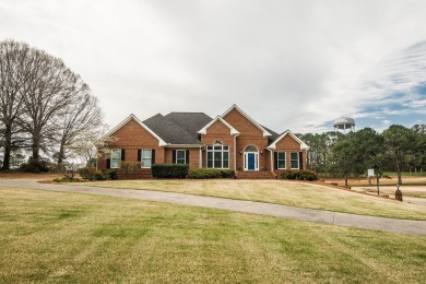 Gorgeous curb appeal on this Brick Traditional home on the golf on Spring Lakes Golf Club in Georgia - for sale on GolfHomes.com, golf home, golf lot