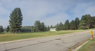 Discover your dream homesite with this beautiful 1/2 acre treed on Angel Fire Resort Country Club in New Mexico - for sale on GolfHomes.com, golf home, golf lot