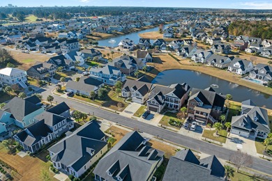 This exquisite single-level home on a pristine lake lot in the on Myrtlewood Golf Course and Club  in South Carolina - for sale on GolfHomes.com, golf home, golf lot