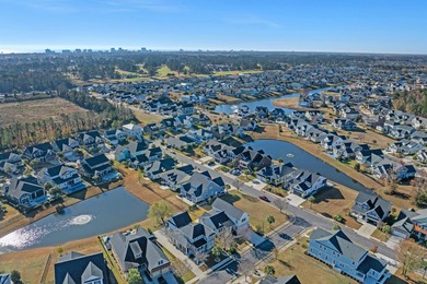 This exquisite single-level home on a pristine lake lot in the on Myrtlewood Golf Course and Club  in South Carolina - for sale on GolfHomes.com, golf home, golf lot