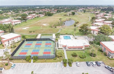 THIS MUST BE THE PLACE! Opportunity knocks at this top floor on The American Golf Club in Florida - for sale on GolfHomes.com, golf home, golf lot