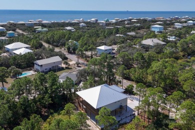 Welcome to your dream coastal retreat in the serene Fort Morgan on Kiva Dunes Golf Club in Alabama - for sale on GolfHomes.com, golf home, golf lot