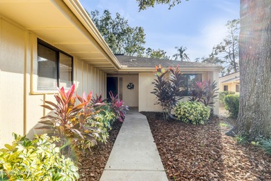 Take in peaceful golf course views from this inviting 2 bedroom on Sugar Mill Country Club in Florida - for sale on GolfHomes.com, golf home, golf lot