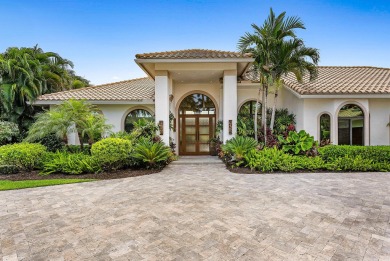 Perched on a rare, oversized lot at the end of a quiet on Boca Delray Golf and Country Club in Florida - for sale on GolfHomes.com, golf home, golf lot