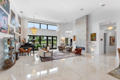 Perched on a rare, oversized lot at the end of a quiet on Boca Delray Golf and Country Club in Florida - for sale on GolfHomes.com, golf home, golf lot