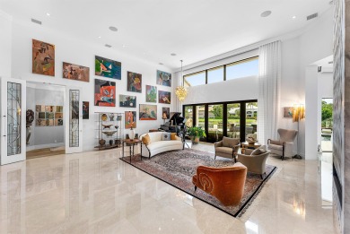 Perched on a rare, oversized lot at the end of a quiet on Boca Delray Golf and Country Club in Florida - for sale on GolfHomes.com, golf home, golf lot