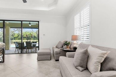 This open floor plan is light and bright with 2 bedrooms plus a on The Golf Club At Fiddlers Creek in Florida - for sale on GolfHomes.com, golf home, golf lot