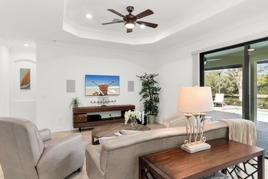 This open floor plan is light and bright with 2 bedrooms plus a on The Golf Club At Fiddlers Creek in Florida - for sale on GolfHomes.com, golf home, golf lot