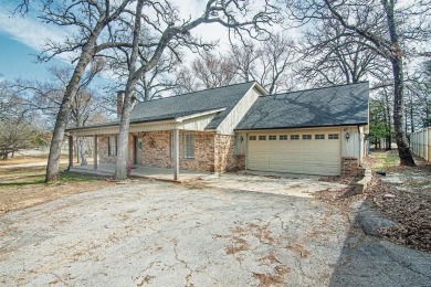 The property at 313 Comanche Drive in Lake Kiowa, Texas, is a on Lake Kiowa Golf Course in Texas - for sale on GolfHomes.com, golf home, golf lot