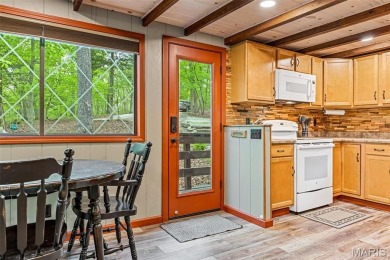 Say hello to summer at Wilderness Escape, a charming Innsbrook on Innsbrook Resort Golf Course in Missouri - for sale on GolfHomes.com, golf home, golf lot