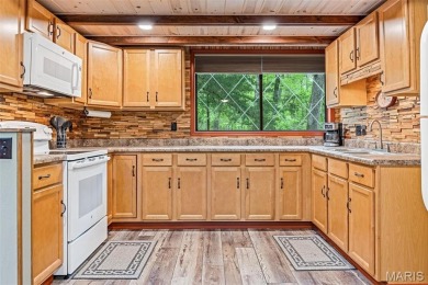Say hello to summer at Wilderness Escape, a charming Innsbrook on Innsbrook Resort Golf Course in Missouri - for sale on GolfHomes.com, golf home, golf lot