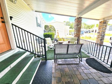 This home is located on leased land in a 55+ resort-style MH on Big Cypress Golf and Country Club in Florida - for sale on GolfHomes.com, golf home, golf lot