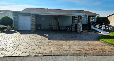 This home is located on leased land in a 55+ resort-style MH on Big Cypress Golf and Country Club in Florida - for sale on GolfHomes.com, golf home, golf lot