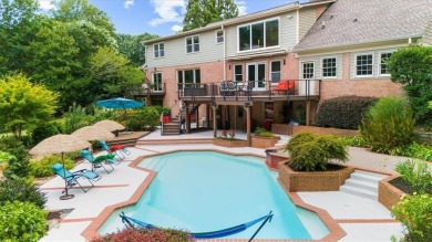 Nestled on a private, one-acre lot just moments from Highway 400 on Cherokee Town and Country Club in Georgia - for sale on GolfHomes.com, golf home, golf lot