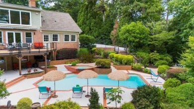 Nestled on a private, one-acre lot just moments from Highway 400 on Cherokee Town and Country Club in Georgia - for sale on GolfHomes.com, golf home, golf lot