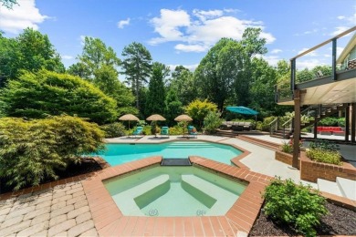 Nestled on a private, one-acre lot just moments from Highway 400 on Cherokee Town and Country Club in Georgia - for sale on GolfHomes.com, golf home, golf lot