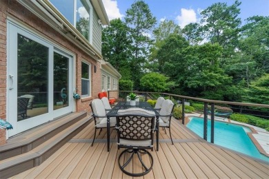 Nestled on a private, one-acre lot just moments from Highway 400 on Cherokee Town and Country Club in Georgia - for sale on GolfHomes.com, golf home, golf lot