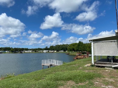 THIS TRIPLE WIDE LAKE FRONT HOME LOCATED IN THE ALL AGES SILVER on Silver Dollar Golf and Trap Club in Florida - for sale on GolfHomes.com, golf home, golf lot