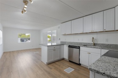 This adorable fully renovated manufactured home is the perfect on Silver Lake Executive Golf Course in Florida - for sale on GolfHomes.com, golf home, golf lot