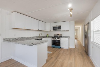 This adorable fully renovated manufactured home is the perfect on Silver Lake Executive Golf Course in Florida - for sale on GolfHomes.com, golf home, golf lot