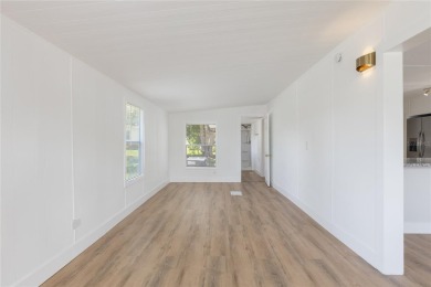 This adorable fully renovated manufactured home is the perfect on Silver Lake Executive Golf Course in Florida - for sale on GolfHomes.com, golf home, golf lot