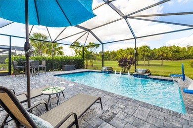 The stunning saltwater pool is the focal point of this exquisite on Pelican Preserve Golf Club in Florida - for sale on GolfHomes.com, golf home, golf lot