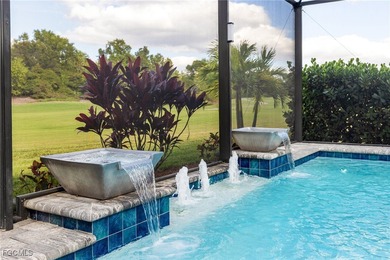 The stunning saltwater pool is the focal point of this exquisite on Pelican Preserve Golf Club in Florida - for sale on GolfHomes.com, golf home, golf lot