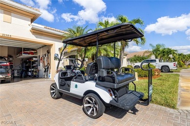 The stunning saltwater pool is the focal point of this exquisite on Pelican Preserve Golf Club in Florida - for sale on GolfHomes.com, golf home, golf lot